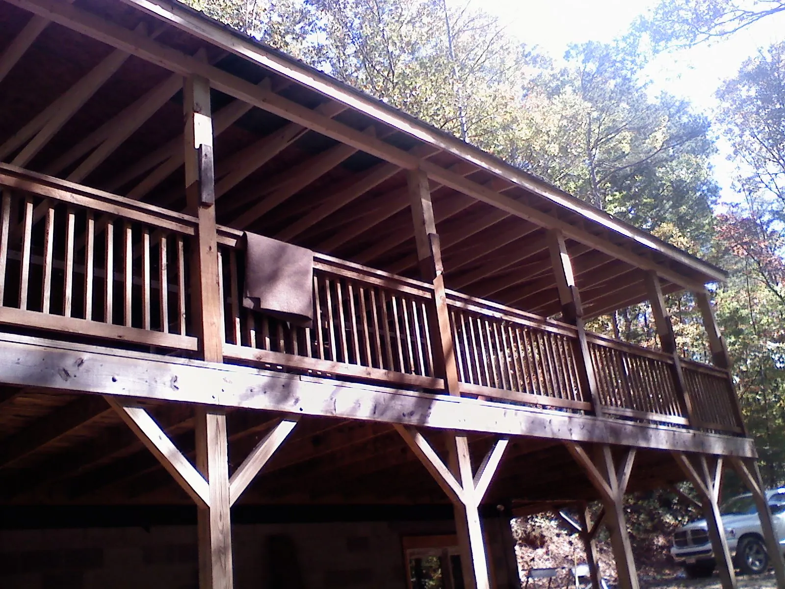 Timber framing under a new elevated porch and deck — Roof Leak Repair in Lanesborough by Roofing Brothers